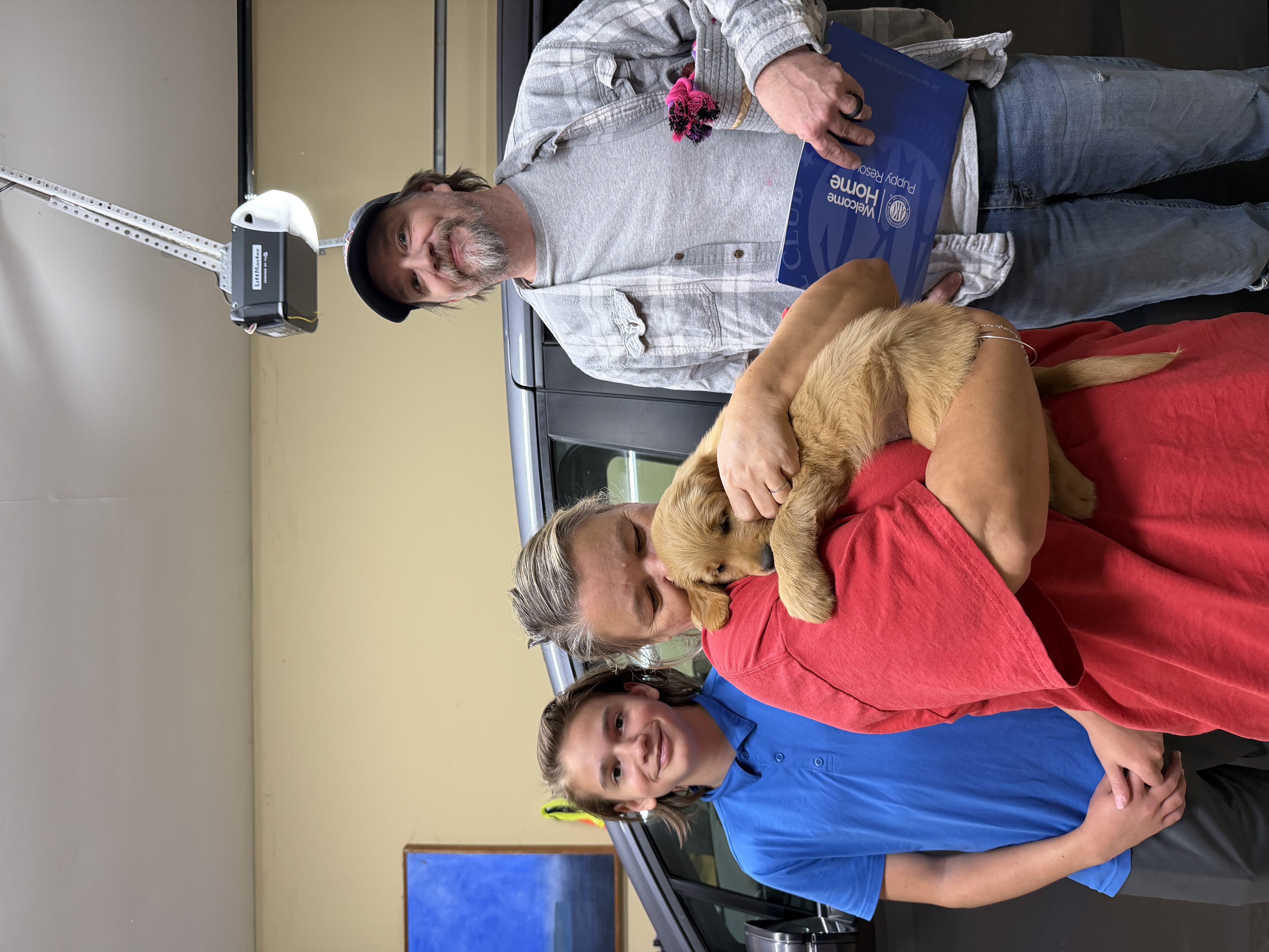 White-collar puppy with her new family