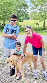 A different photo of a puppy and the brooks family